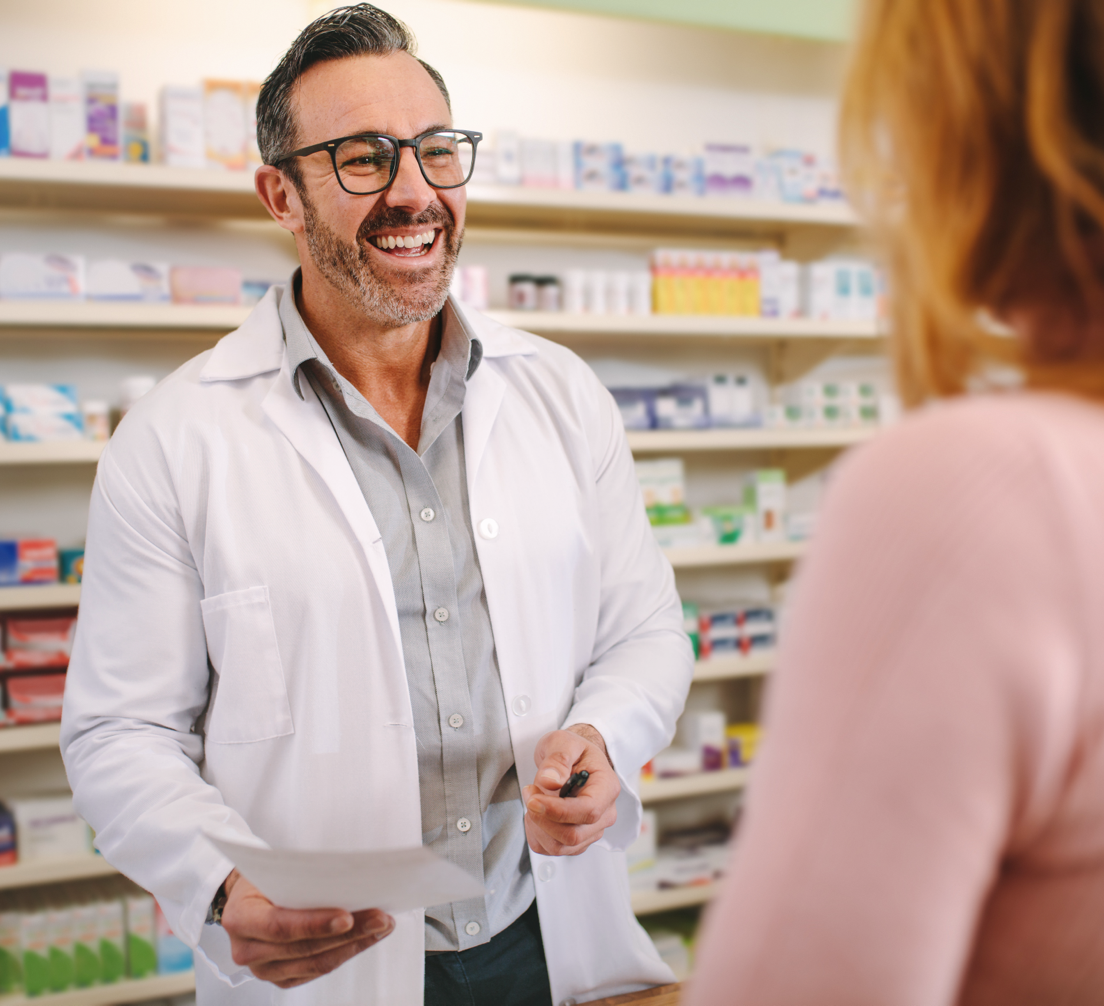 Pharmacist greeting a customer