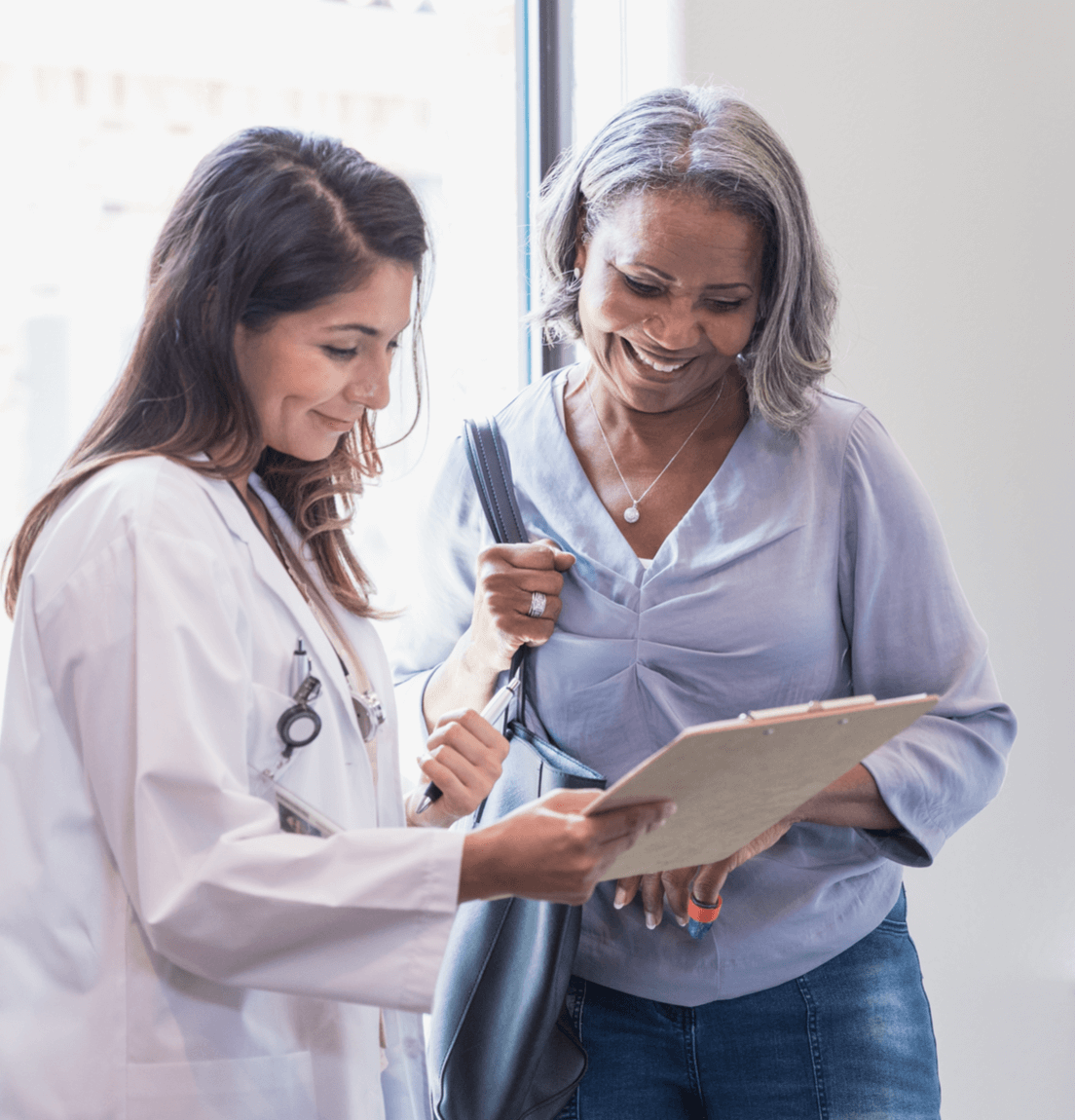 Doctor reviewing chart with patient