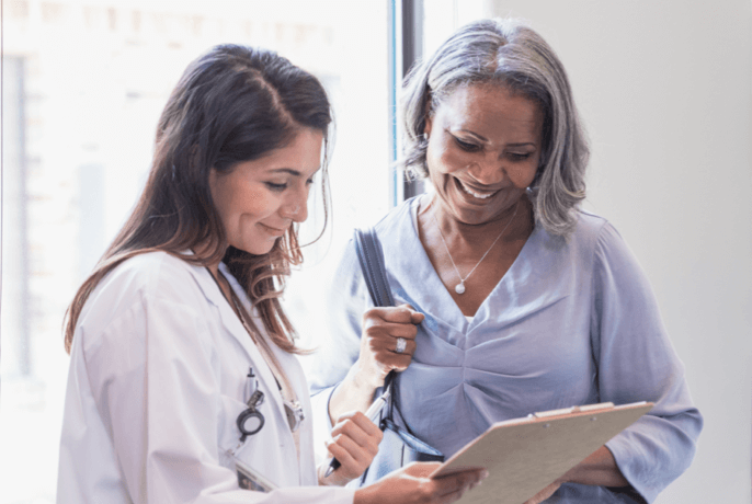 Doctor reviewing chart with patient