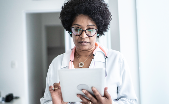 Doctor looking at a tablet