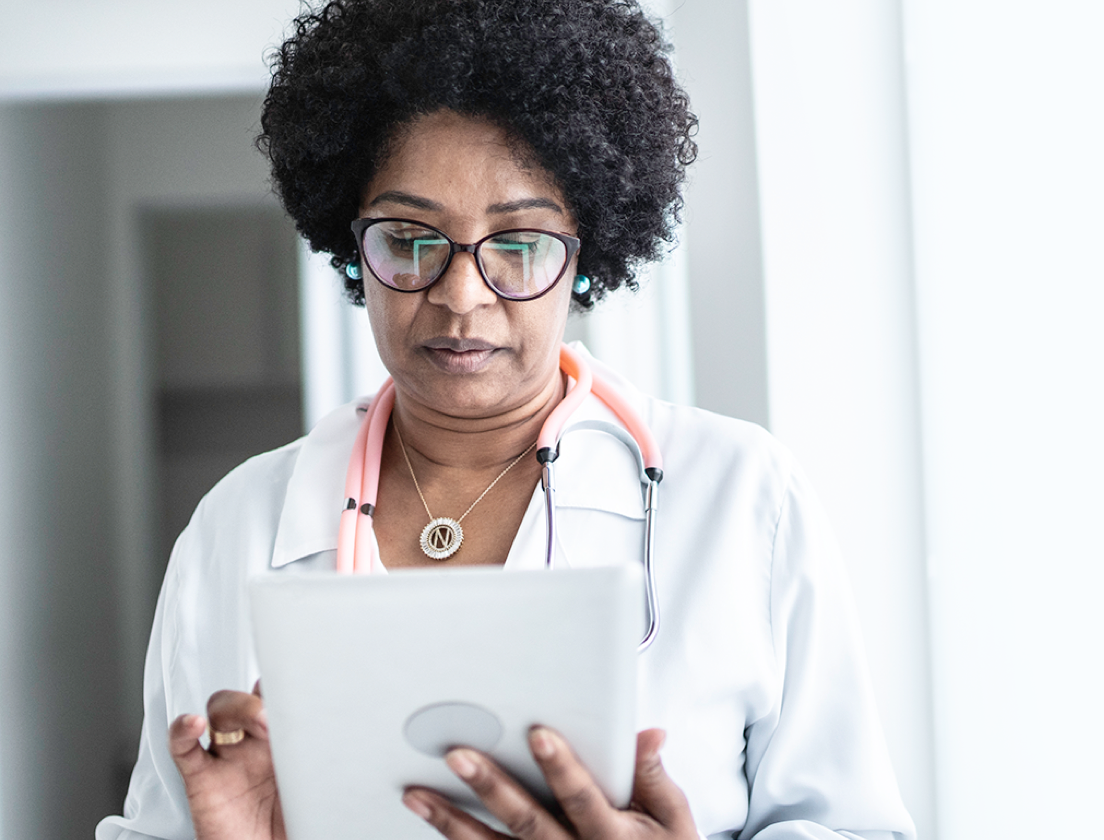 Doctor looking at a tablet