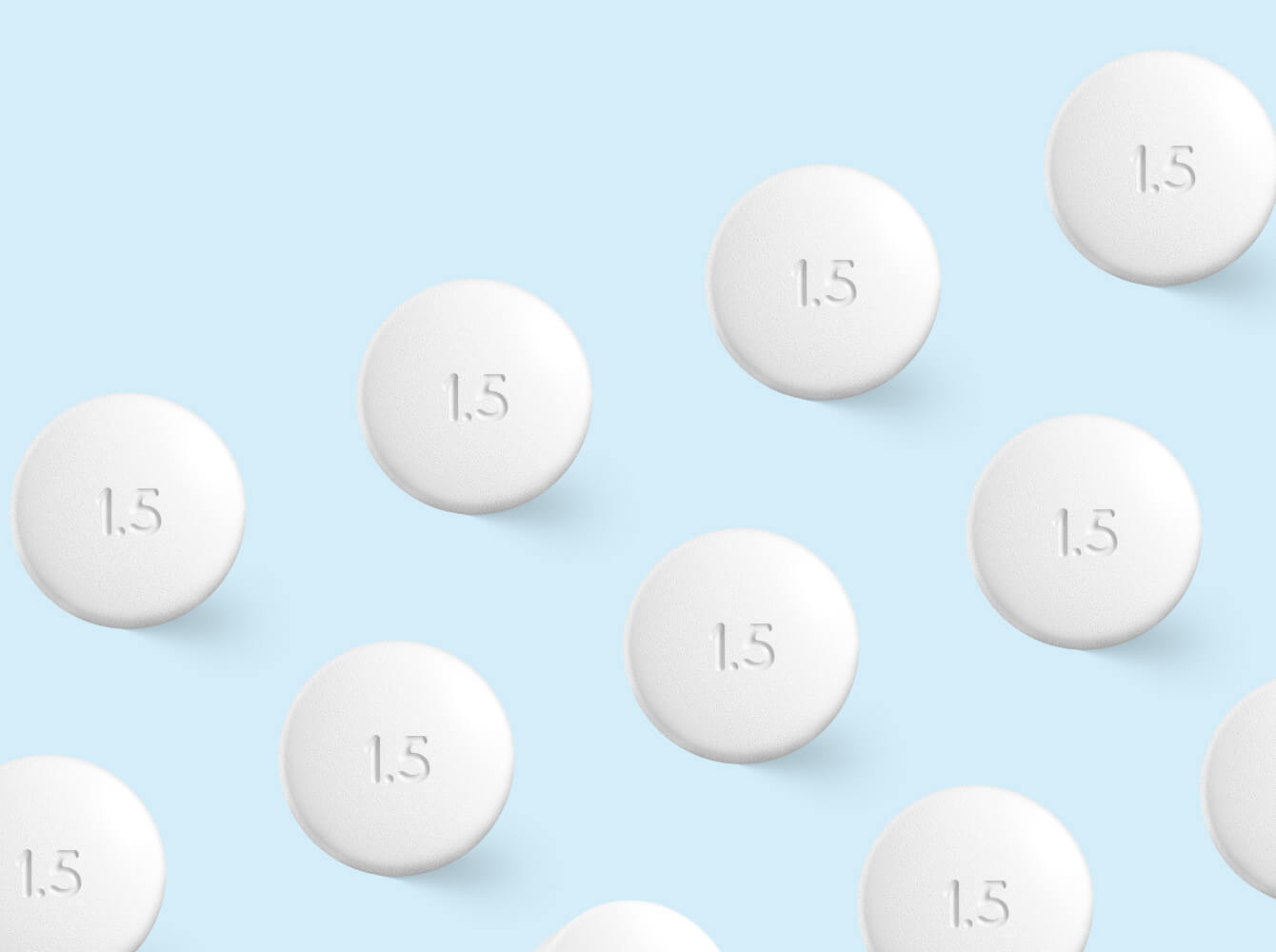 Multiple round white pills with 1.5 text 