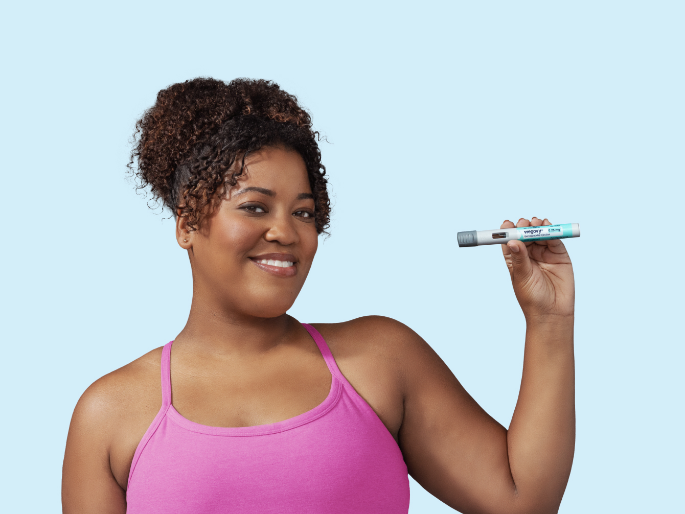 Woman holding a Wegovy® (semaglutide) injection pen