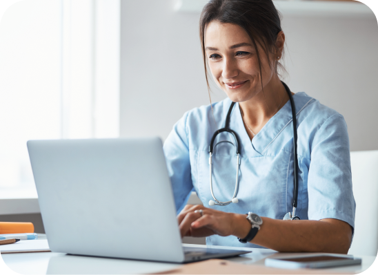 Female doctor looking at a laptop