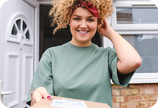 Woman smiling with package