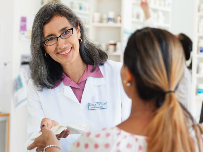 Pharmacist greeting a customer