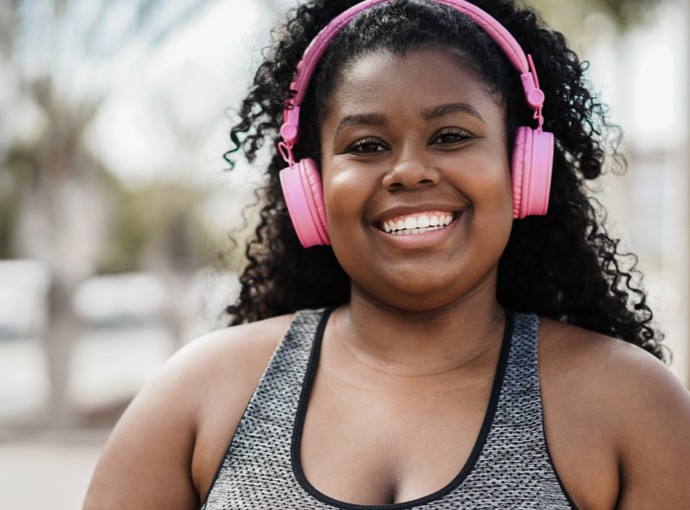 Woman with headphones and water bottle