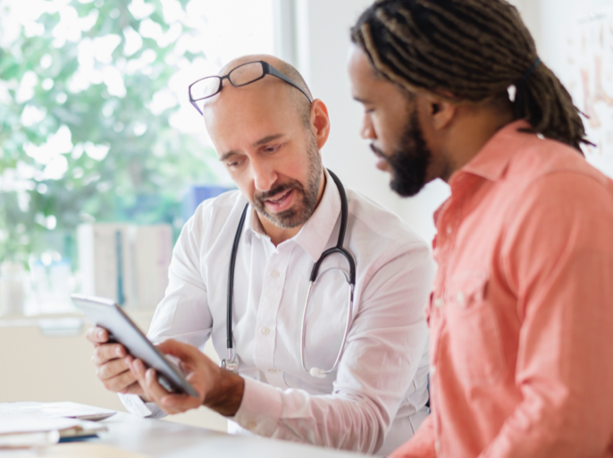 Doctor reviewing chart with patient