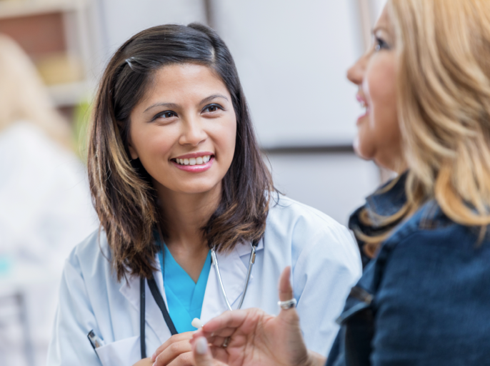 Nurse smiling at patient