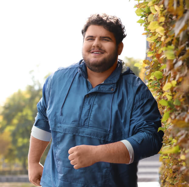 Man walking outside smiling